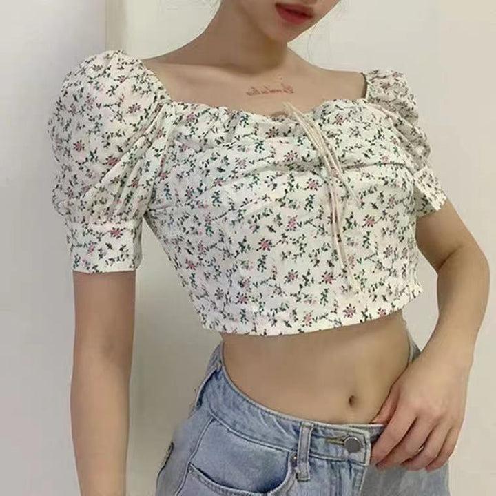Kvinnors crop top med puffärmar och blommönster-Eva Jonsson