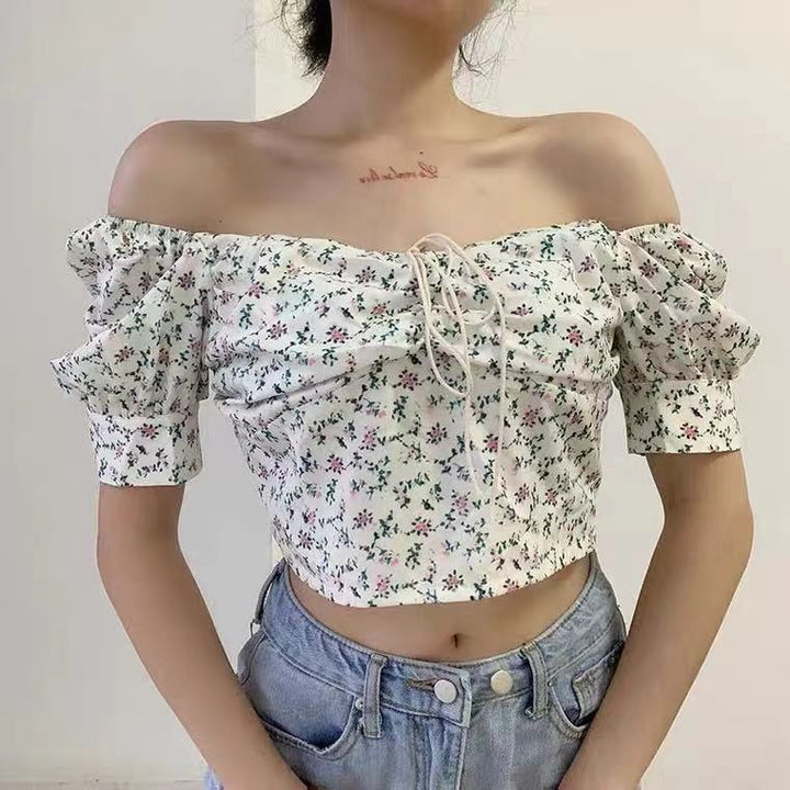 Kvinnors crop top med puffärmar och blommönster-Eva Jonsson