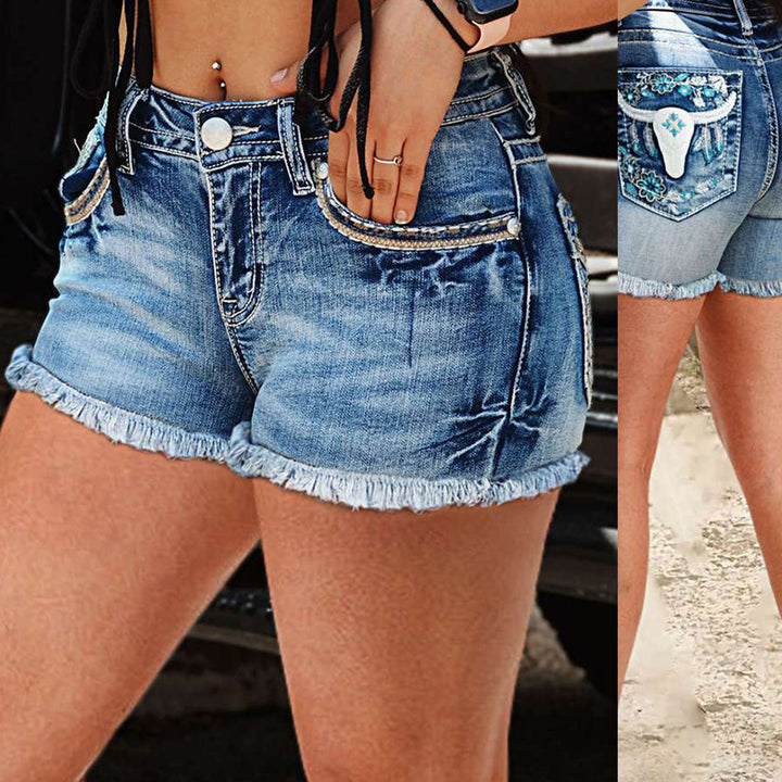 Kvinnors denimshorts med blommönsterbroderi och fransad nederkant Mirla-Eva Jonsson