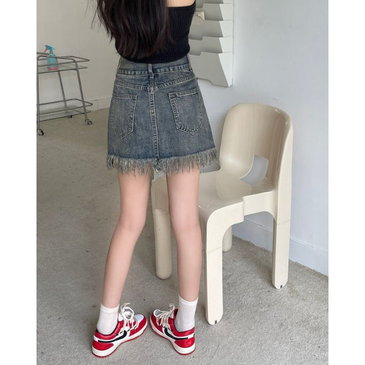 Kvinnors denimshorts med fransad nederkant och hög midja-Eva Jonsson