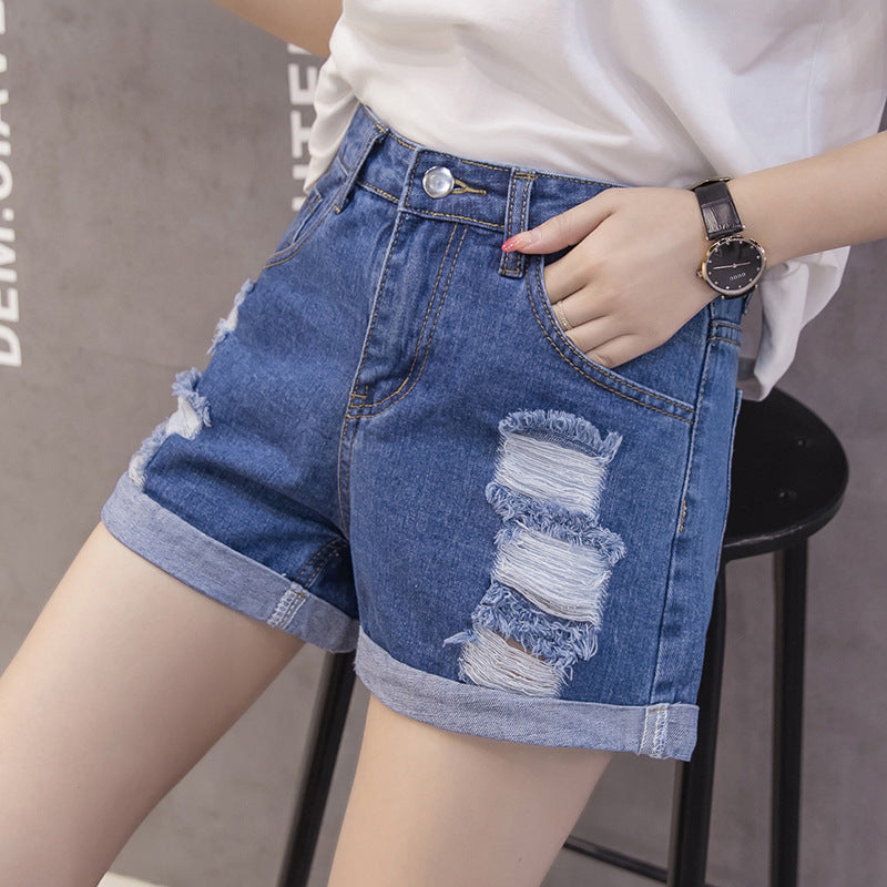 Kvinnors denimshorts med trendig slitna design och avslappnad uppvikning-Eva Jonsson