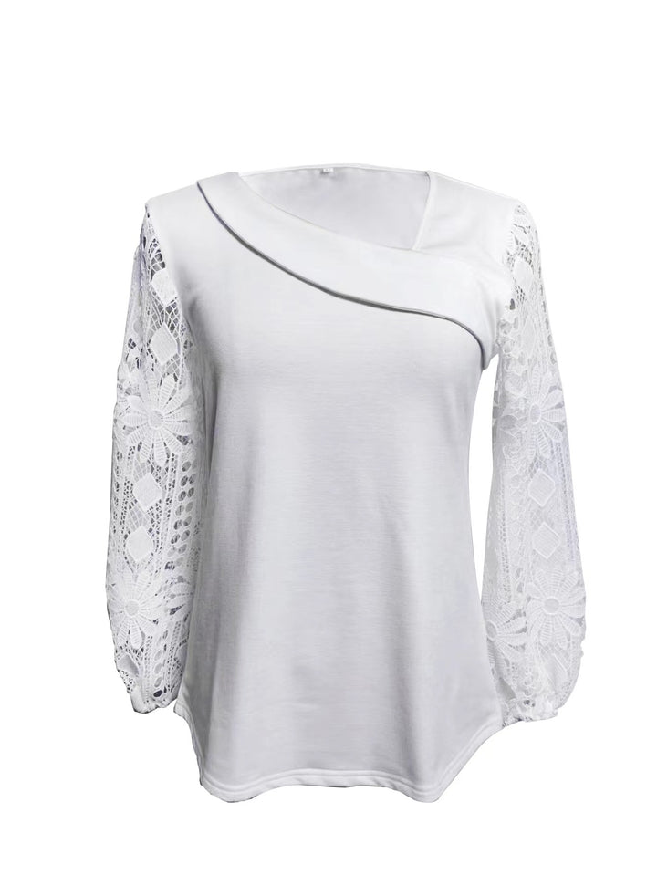 Kvinnors designerblus med spetsinsatser och elegant skärning Mirla-Eva Jonsson