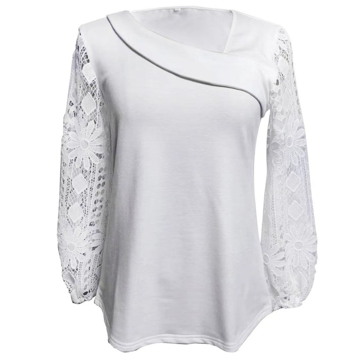 Kvinnors designerblus med spetsinsatser och elegant skärning Mirla-Eva Jonsson
