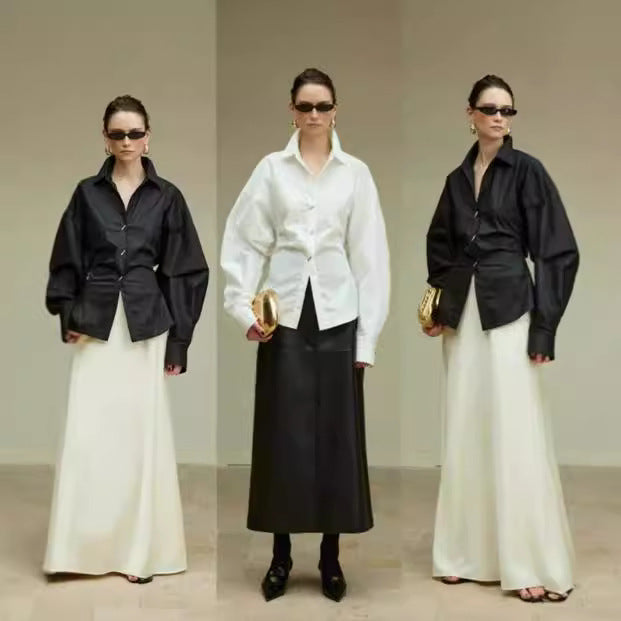 Kvinnors designerblus med voluminösa ärmar och utsökta knappdetaljer Mirla-Eva Jonsson