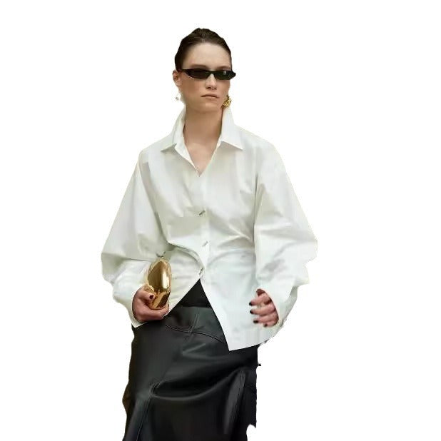 Kvinnors designerblus med voluminösa ärmar och utsökta knappdetaljer Mirla-Eva Jonsson