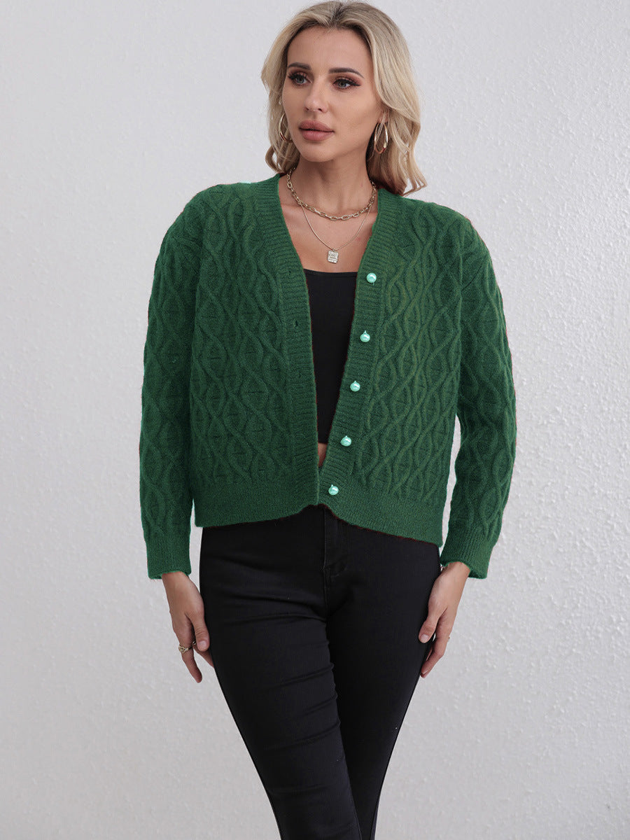 Kvinnors designerkofta med kabelmönster och mjuka färger Mirla-Eva Jonsson