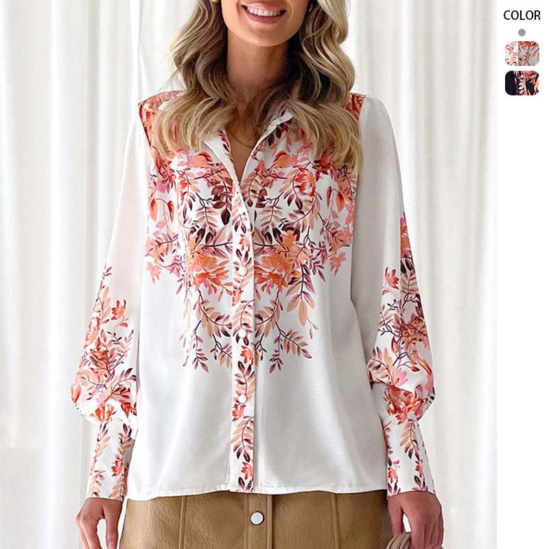 Kvinnors elegant blus med blommiga accenter och trendiga puffärmar Mirla-Eva Jonsson