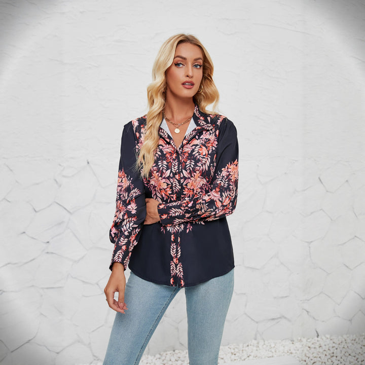 Kvinnors elegant blus med blommönster och voluminösa ärmar-Eva Jonsson