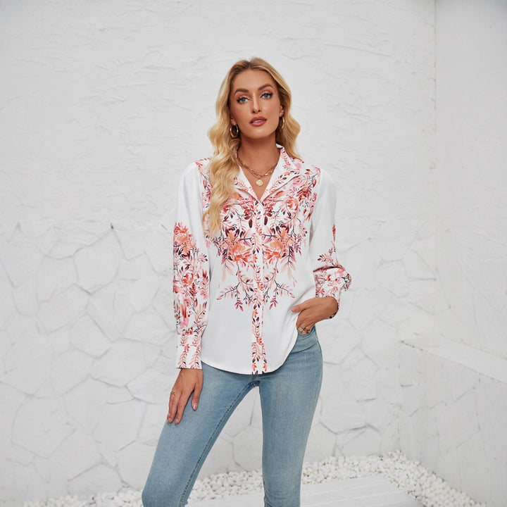 Kvinnors elegant blus med blommönster och voluminösa ärmar-Eva Jonsson