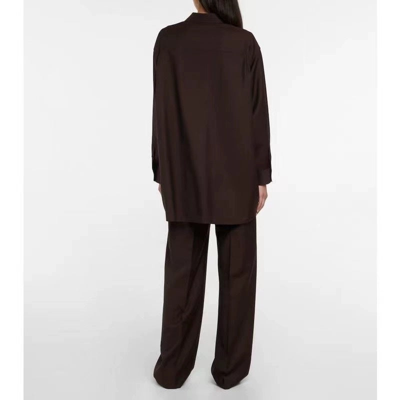 Kvinnors elegant långärmad blus med minimalistisk knappslå Mirla-Eva Jonsson