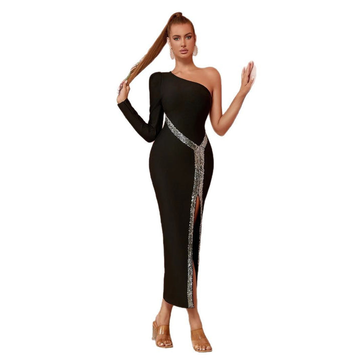 Kvinnors elegant maxi-kjol med asymmetrisk skärning och glittrande detalj Mirla-Eva Jonsson