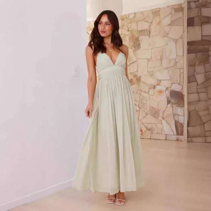 Kvinnors elegant maxi klänning med djup V-ringning och flödande kjol Mirla-Eva Jonsson