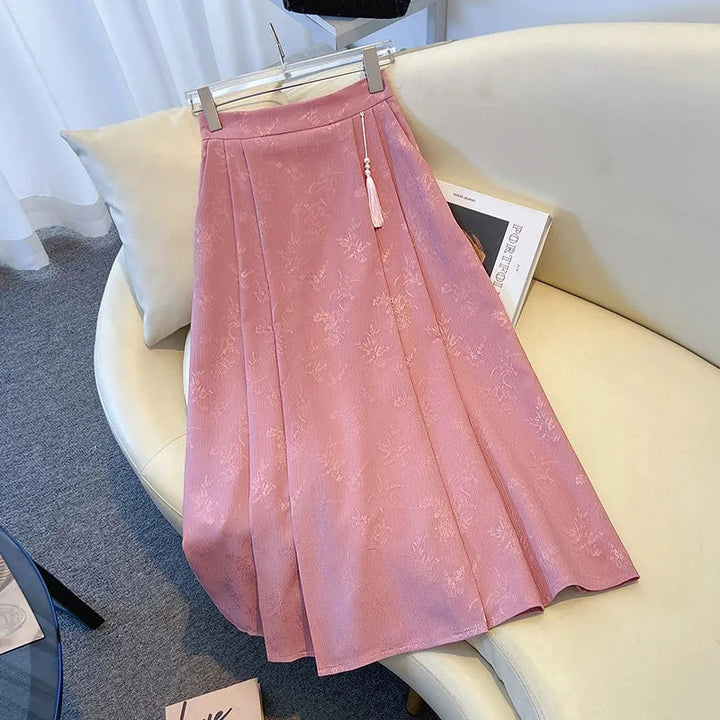 Kvinnors elegant midi kjol med texturerad tyg och flytande snitt-Eva Jonsson