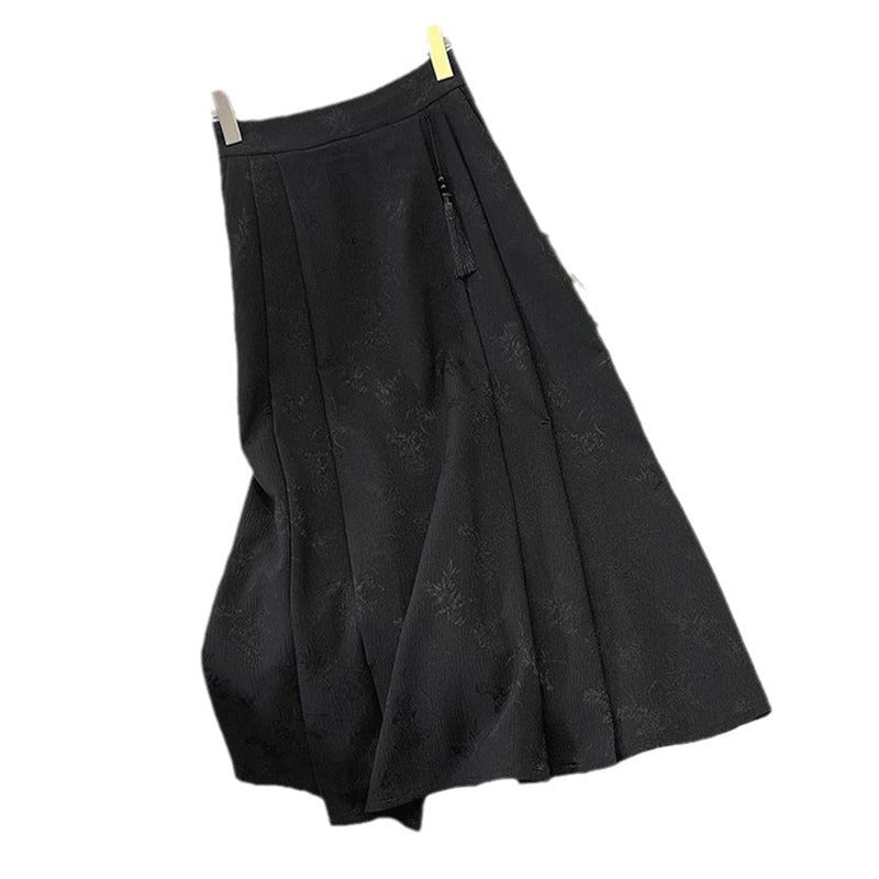 Kvinnors elegant midi kjol med texturerad tyg och flytande snitt-Eva Jonsson