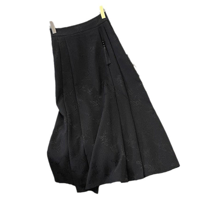 Kvinnors elegant midi kjol med texturerad tyg och flytande snitt-Eva Jonsson