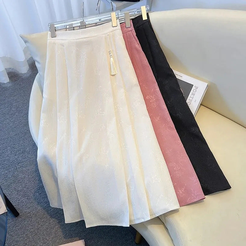 Kvinnors elegant midi kjol med texturerad tyg och flytande snitt-Eva Jonsson