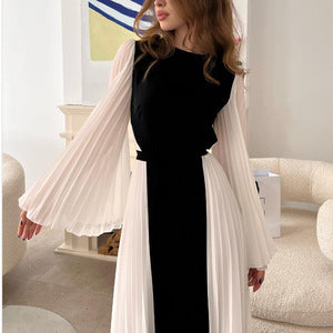 Kvinnors elegant och asymmetrisk aftonklänning med veckdetaljer Mirla-Eva Jonsson