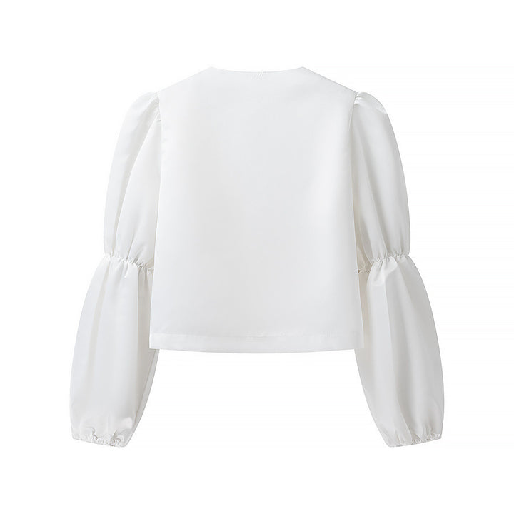 Kvinnors elegant skräddarsydda blus med voluminösa ärmar Mirla-Eva Jonsson