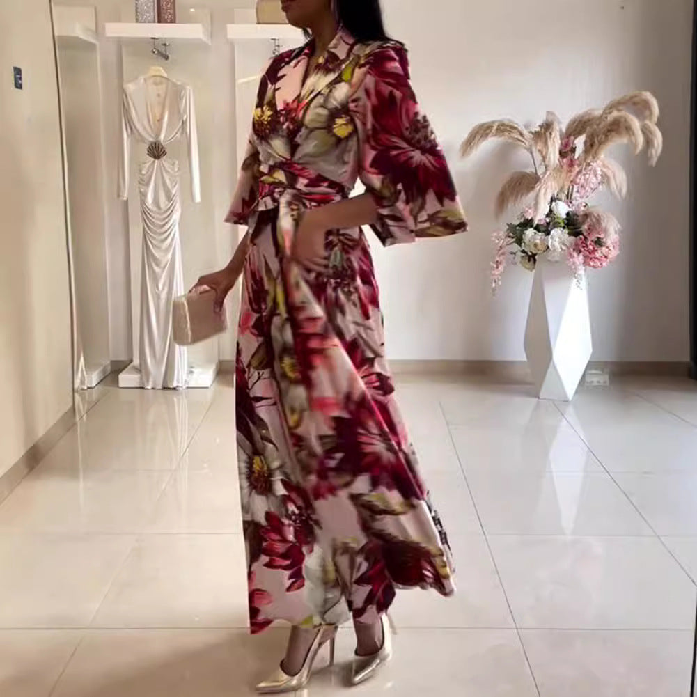 Kvinnors eleganta blommiga klänning med figursydd midja och vida ärmar Mirla-Eva Jonsson