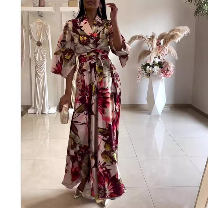Kvinnors eleganta blommiga klänning med figursydd midja och vida ärmar Mirla-Eva Jonsson