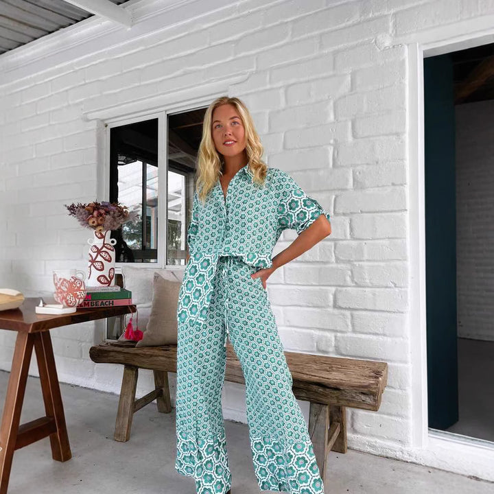 Kvinnors eleganta blus-byxdress med blommönster och lös passform-Eva Jonsson