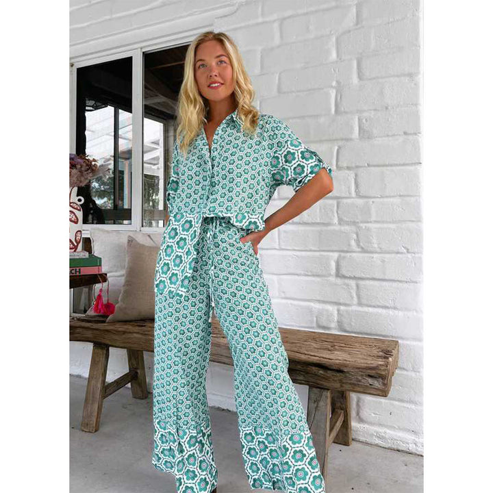 Kvinnors eleganta blus-byxdress med blommönster och lös passform-Eva Jonsson