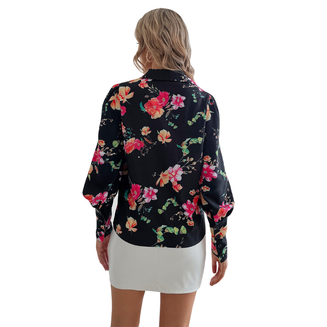 Kvinnors eleganta blus med blommönster och puffärmar Mirla-Eva Jonsson