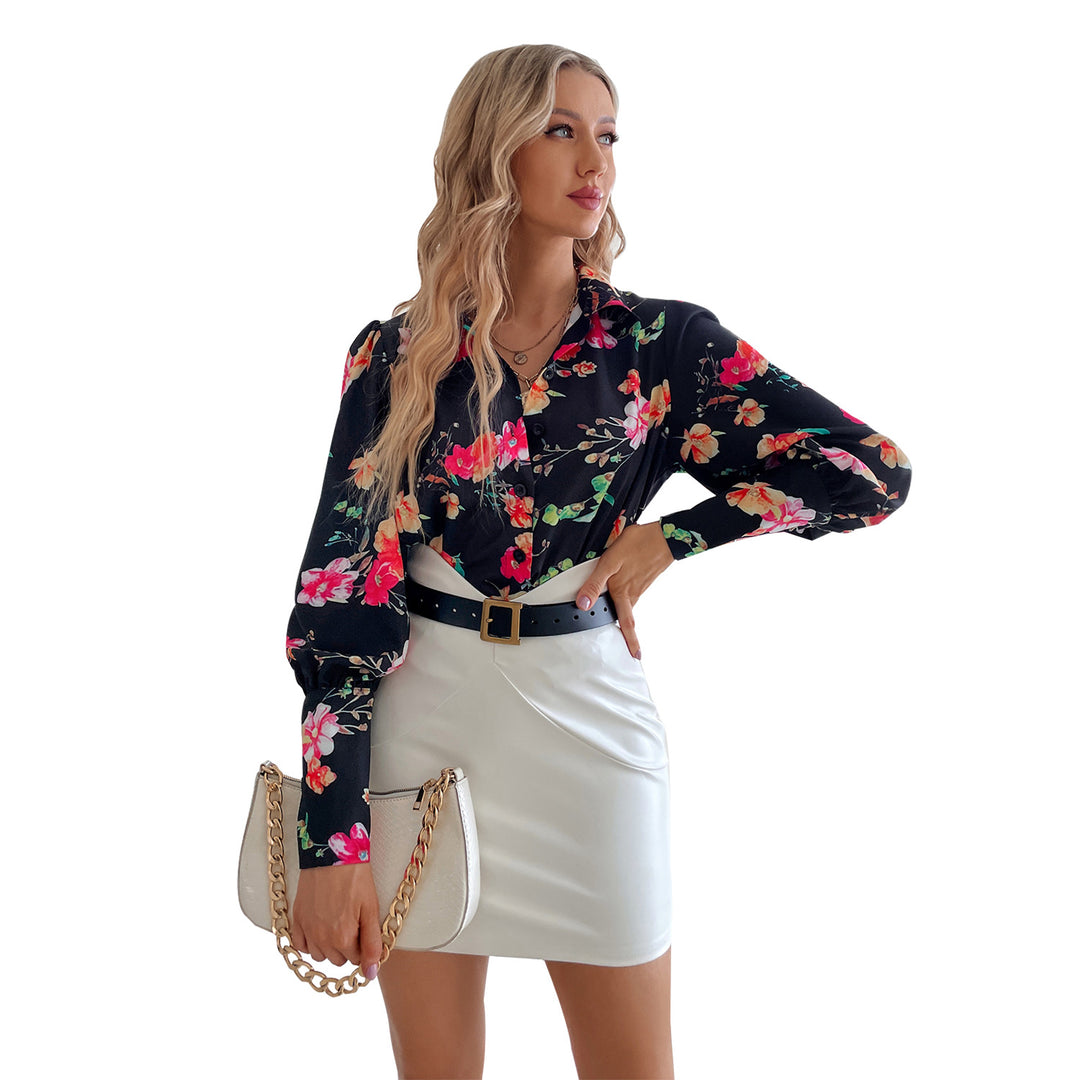 Kvinnors eleganta blus med blommönster och puffärmar Mirla-Eva Jonsson