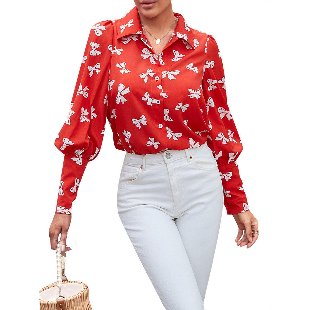 Kvinnors eleganta blus med blommönster och puffärmar Mirla-Eva Jonsson