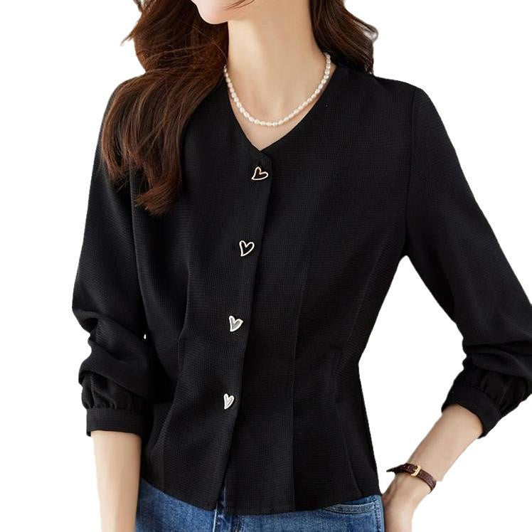 Kvinnors eleganta blus med hjärtformade knappdetaljer och voluminösa ärmar Mirla-Eva Jonsson