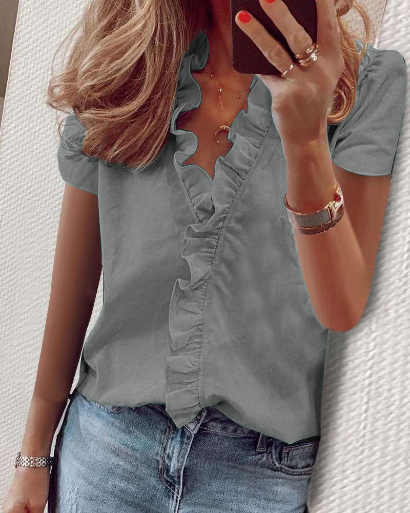 Kvinnors eleganta blus med volangdetalj Mirla-Eva Jonsson