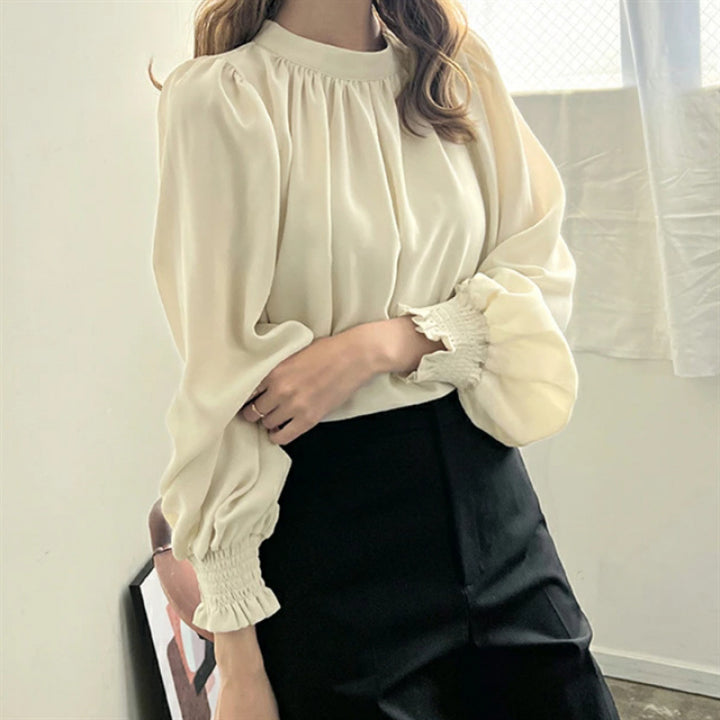 Kvinnors eleganta blus med voluminösa ärmar och ståkrage Mirla-Eva Jonsson