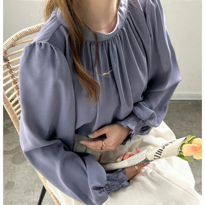 Kvinnors eleganta blus med voluminösa ärmar och ståkrage Mirla-Eva Jonsson