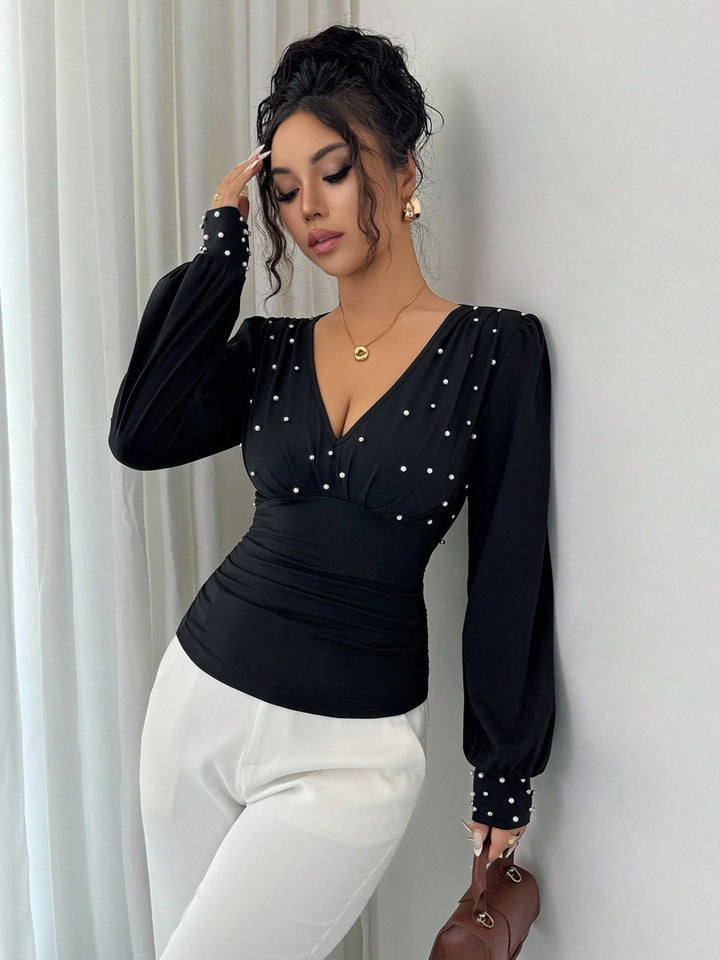 Kvinnors eleganta blus skjorta med V-hals och dekoration Mirla-Eva Jonsson