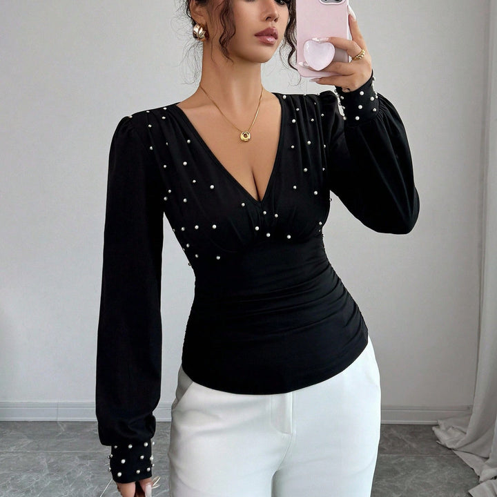 Kvinnors eleganta blus skjorta med V-hals och dekoration Mirla-Eva Jonsson