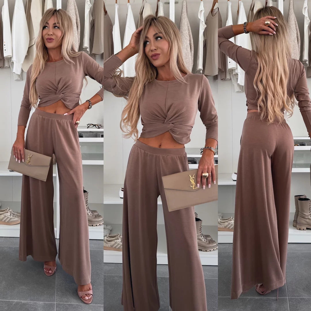 Kvinnors eleganta fritidsset med crop top och vida byxor-Eva Jonsson