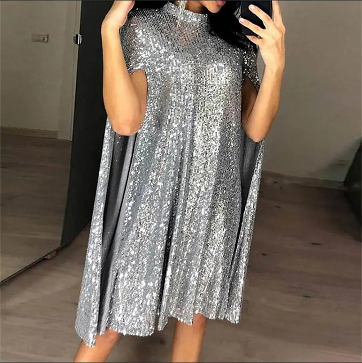 Kvinnors eleganta glittrande kvällsklänning med vid passform och glittrande utseende-Eva Jonsson
