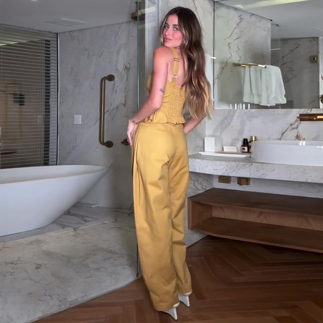 Kvinnors eleganta jumpsuit med peplumdetalj och vida ben Mirla-Eva Jonsson