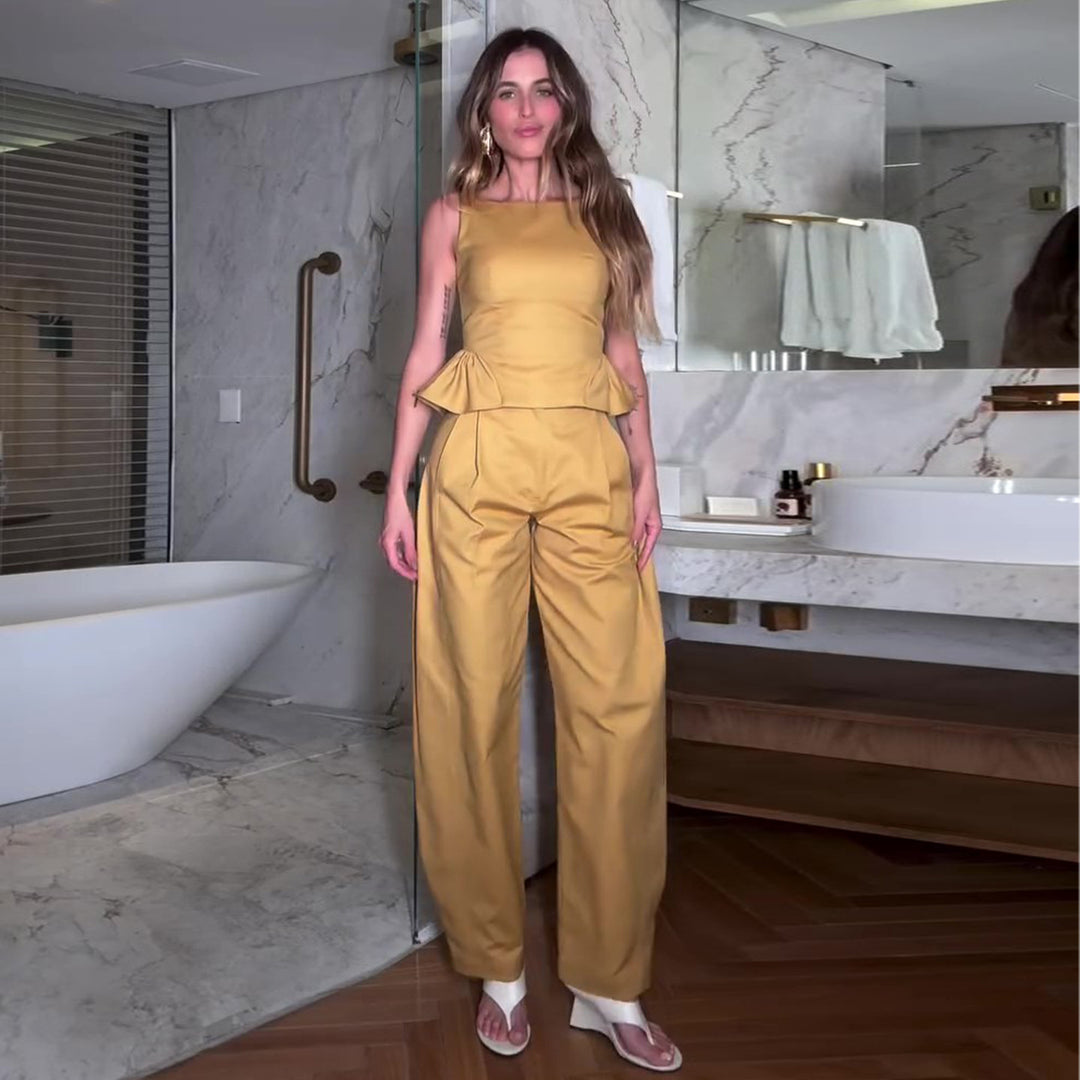 Kvinnors eleganta jumpsuit med peplumdetalj och vida ben Mirla-Eva Jonsson