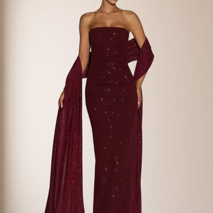 Kvinnors eleganta kvällsklänning med glittrande paljetter och off-shoulder design-Eva Jonsson