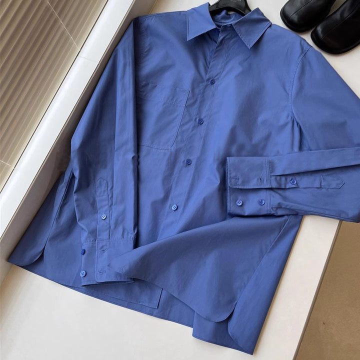 Kvinnors eleganta långärmad blus med knappslå och bröstficka Mirla-Eva Jonsson