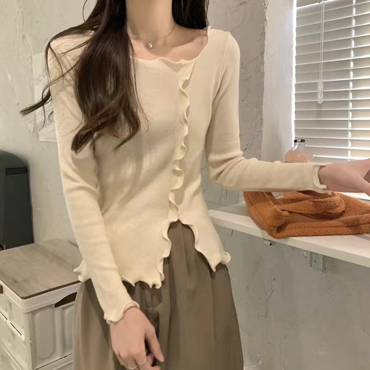 Kvinnors eleganta långärmad topp med vågig fåll och fashionabla detaljer Mirla-Eva Jonsson