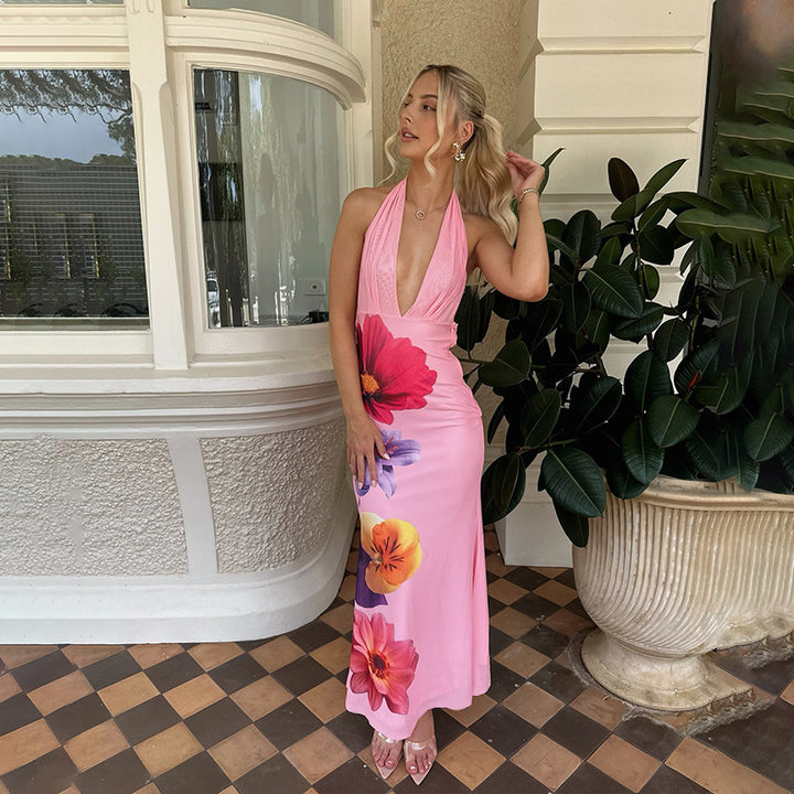 Kvinnors eleganta maxiklänning med djup V-hals och blommig design Mirla-Eva Jonsson