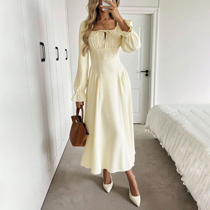 Kvinnors eleganta maxiklänning med sofistikerad dragsko och puffärmar Mirla-Eva Jonsson