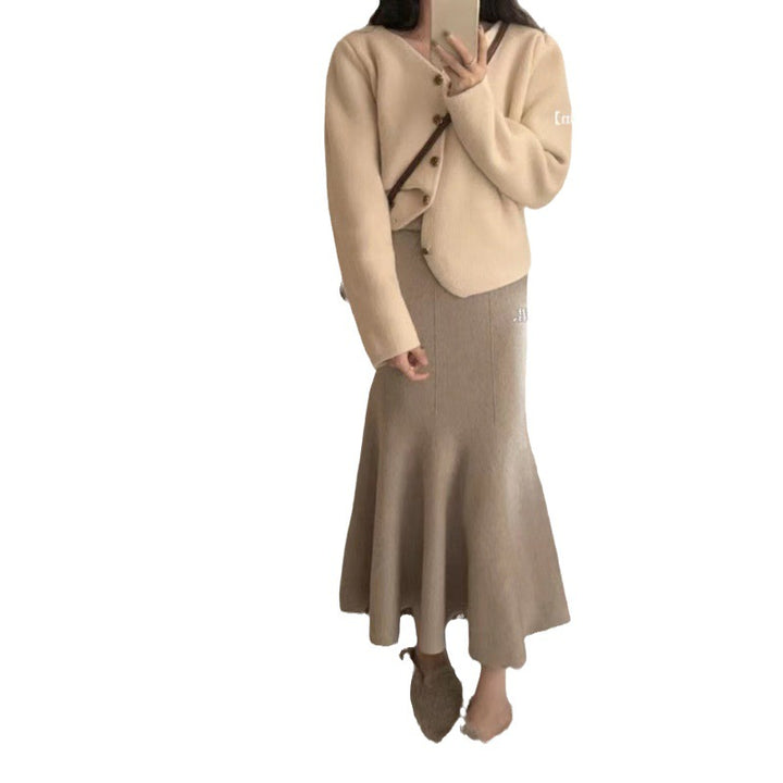 Kvinnors eleganta midi kjol med svängande fåll och hög midja Mirla-Eva Jonsson