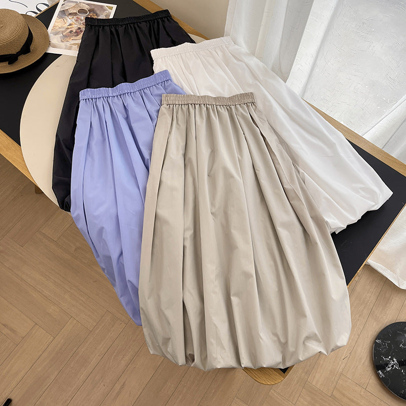 Kvinnors eleganta midikjol med elastisk midja och voluminös skärning Mirla-Eva Jonsson
