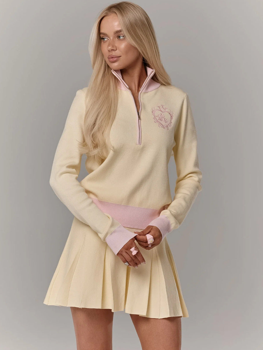 Kvinnors eleganta och sportiga stickade minikjol med hög krage och dragkedja Mirla-Eva Jonsson