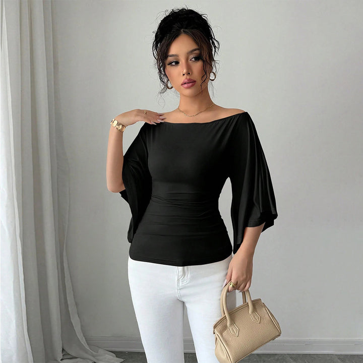 Kvinnors eleganta off-shoulder topp med breda ärmar och figurnära passform Mirla-Eva Jonsson