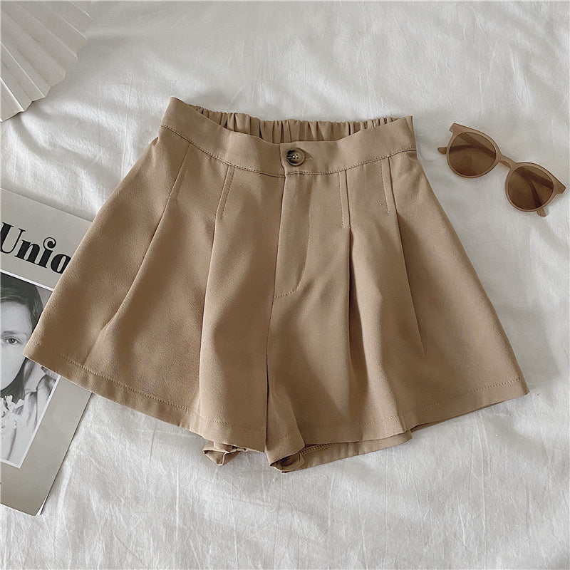 Kvinnors eleganta shorts med veck och knappdetalj-Eva Jonsson