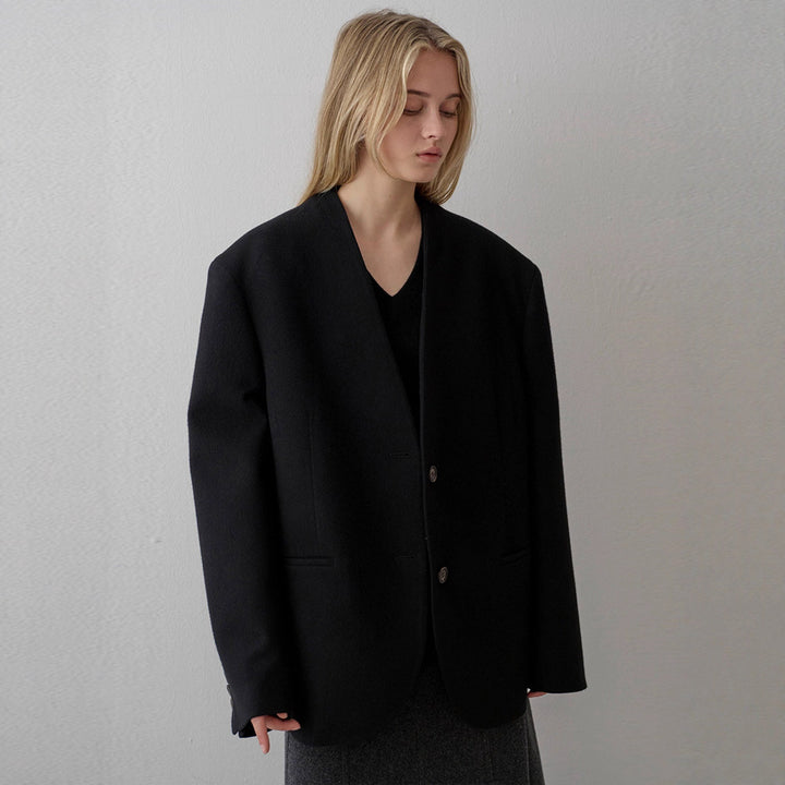Kvinnors eleganta stickade blazer med asymmetrisk skärning Mirla-Eva Jonsson